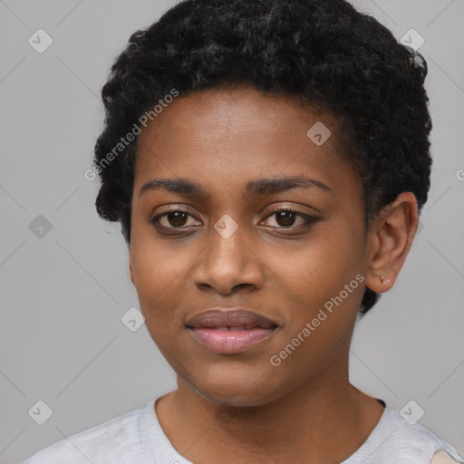 Joyful black young-adult female with short  black hair and brown eyes