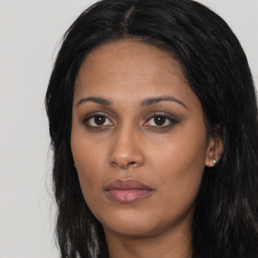 Neutral latino young-adult female with long  black hair and brown eyes