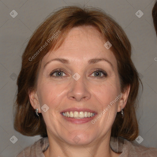 Joyful white adult female with medium  brown hair and blue eyes