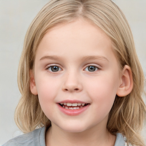 Joyful white child female with medium  brown hair and grey eyes