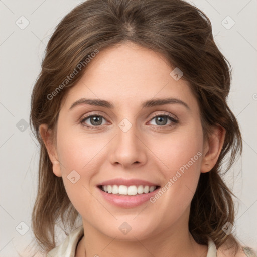 Joyful white young-adult female with medium  brown hair and green eyes