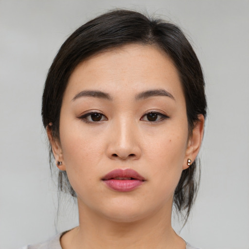 Neutral asian young-adult female with medium  brown hair and brown eyes