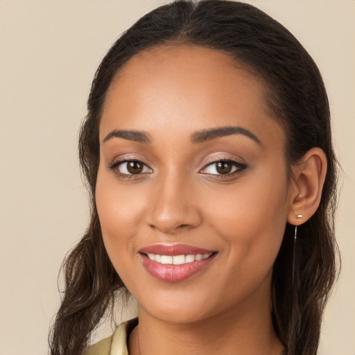 Joyful white young-adult female with long  brown hair and brown eyes