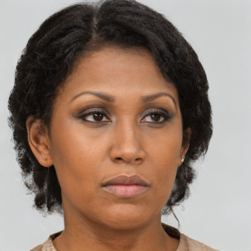 Neutral black adult female with medium  brown hair and brown eyes