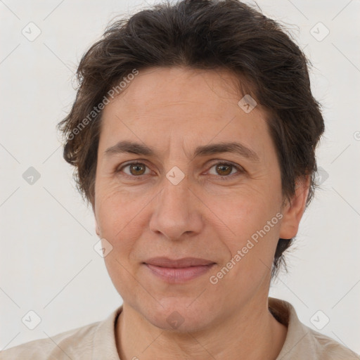 Joyful white adult female with short  brown hair and brown eyes