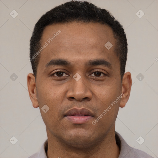 Neutral latino young-adult male with short  black hair and brown eyes