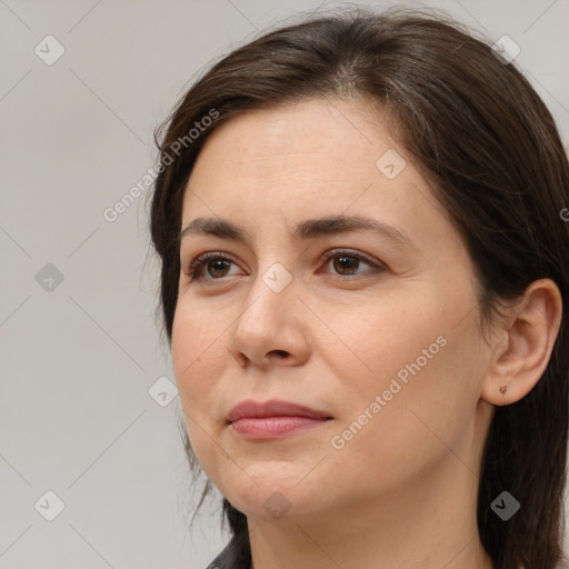 Joyful white adult female with medium  brown hair and brown eyes