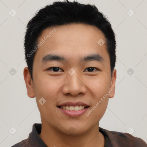 Joyful asian young-adult male with short  black hair and brown eyes