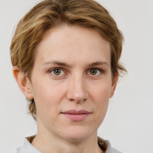 Joyful white young-adult female with medium  brown hair and green eyes