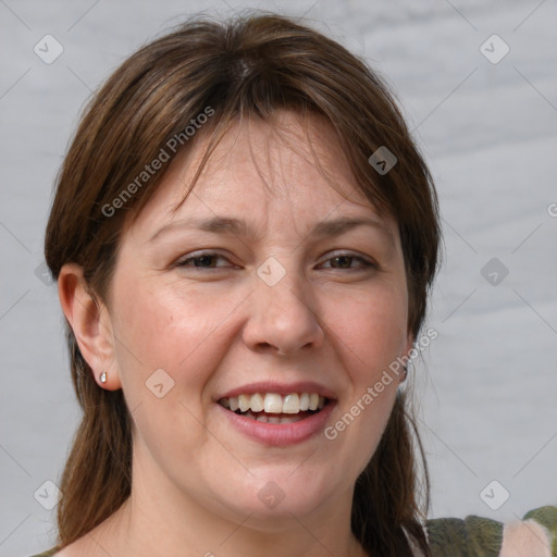 Joyful white adult female with medium  brown hair and grey eyes