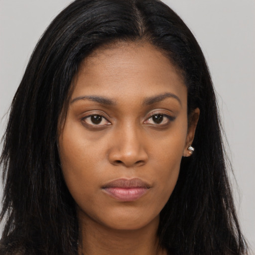 Joyful asian young-adult female with long  brown hair and brown eyes