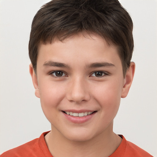 Joyful white child male with short  brown hair and brown eyes