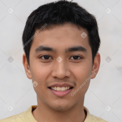 Joyful asian young-adult male with short  brown hair and brown eyes