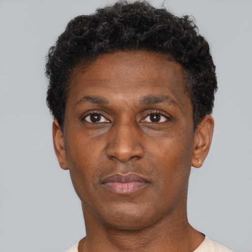 Neutral black adult male with short  brown hair and brown eyes