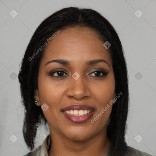 Joyful black young-adult female with long  brown hair and brown eyes