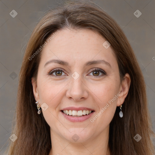 Joyful white adult female with long  brown hair and grey eyes