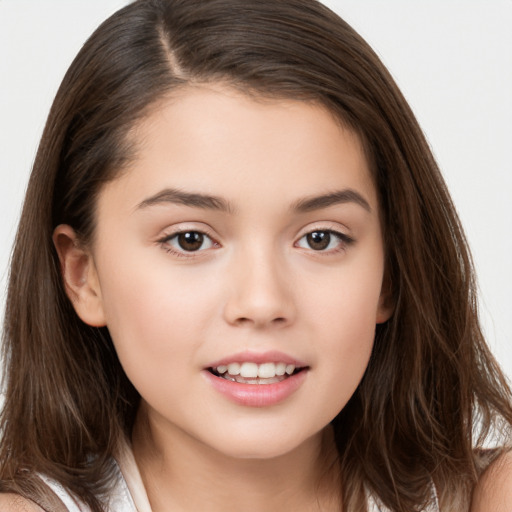 Joyful white child female with long  brown hair and brown eyes