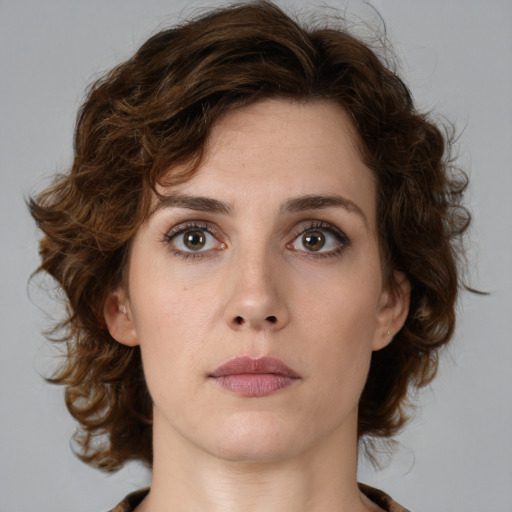 Neutral white young-adult female with medium  brown hair and green eyes