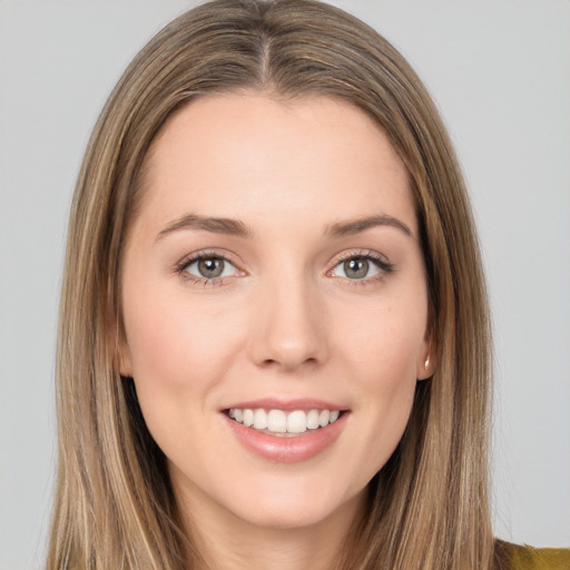 Joyful white young-adult female with long  brown hair and brown eyes