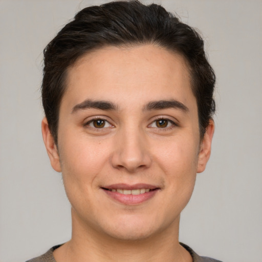 Joyful white young-adult male with short  brown hair and brown eyes