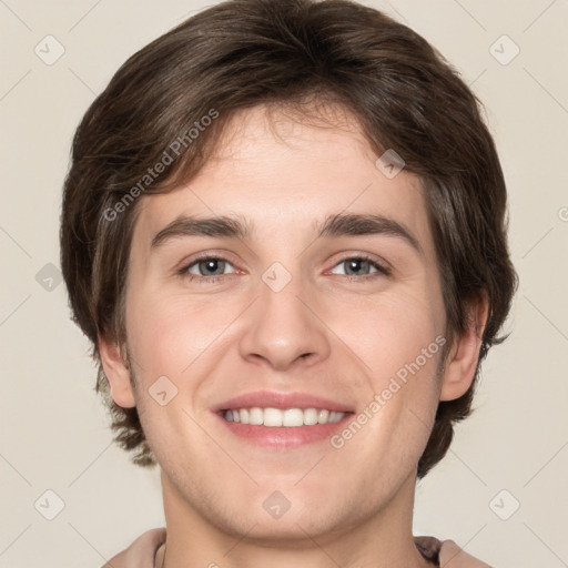 Joyful white young-adult male with medium  brown hair and brown eyes