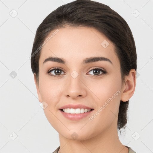 Joyful white young-adult female with short  brown hair and brown eyes