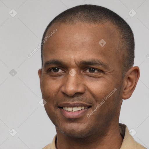 Joyful latino young-adult male with short  brown hair and brown eyes