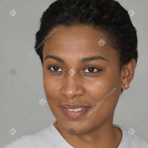 Joyful black young-adult female with short  black hair and brown eyes