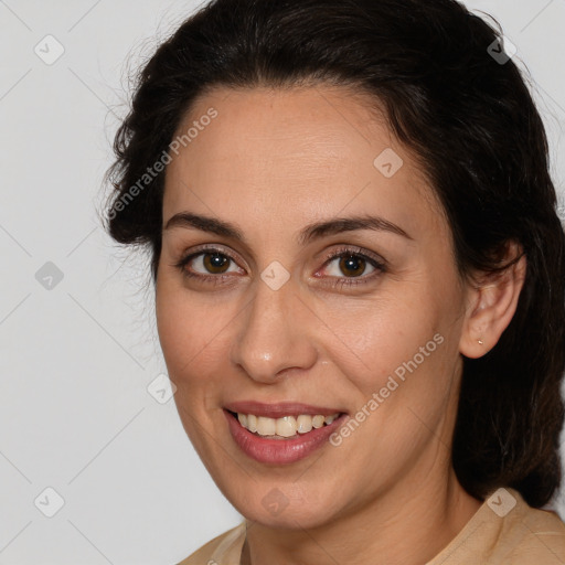 Joyful white adult female with medium  brown hair and brown eyes