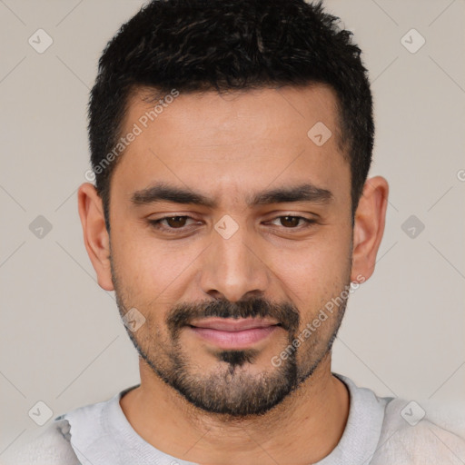 Joyful latino young-adult male with short  black hair and brown eyes