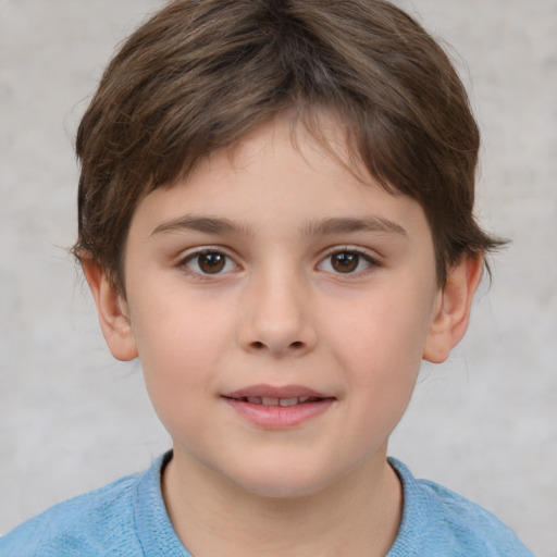 Joyful white child male with short  brown hair and brown eyes