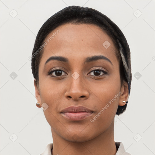 Joyful latino young-adult female with short  black hair and brown eyes