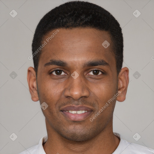 Joyful black young-adult male with short  black hair and brown eyes