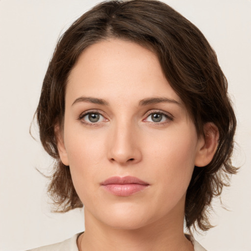 Neutral white young-adult female with medium  brown hair and green eyes