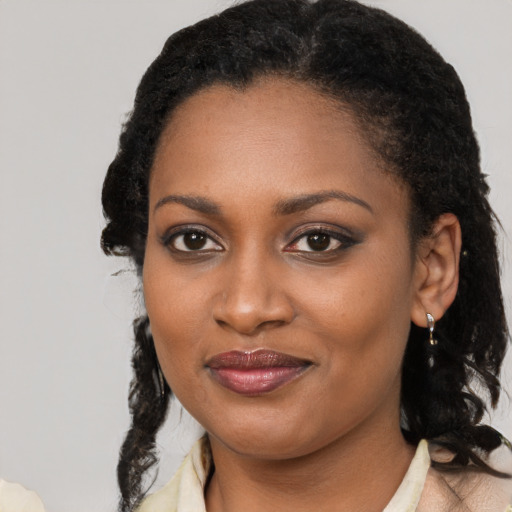 Joyful black young-adult female with medium  black hair and brown eyes