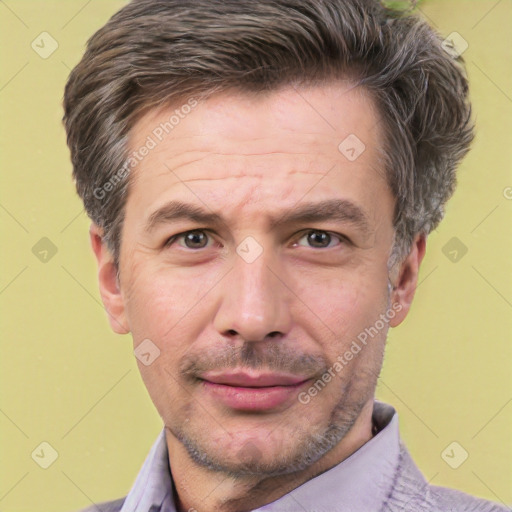 Joyful white adult male with short  brown hair and brown eyes