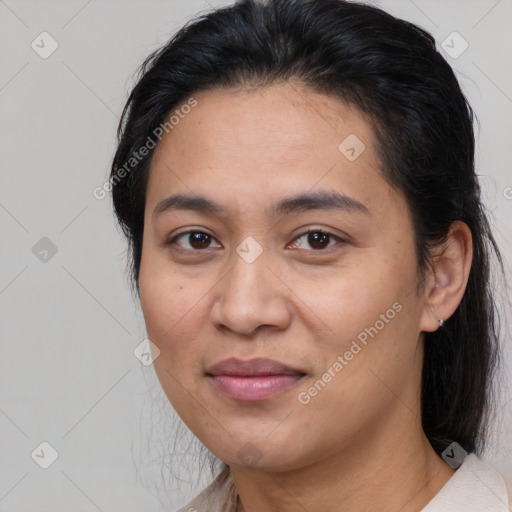 Joyful latino young-adult female with medium  brown hair and brown eyes