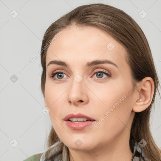 Neutral white young-adult female with medium  brown hair and grey eyes