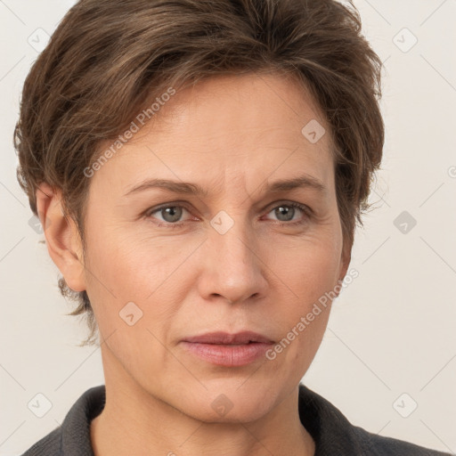 Joyful white adult female with short  brown hair and grey eyes