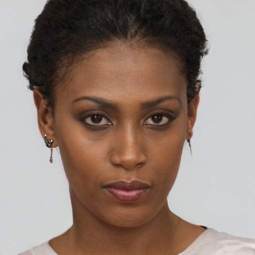 Neutral black young-adult female with short  brown hair and brown eyes