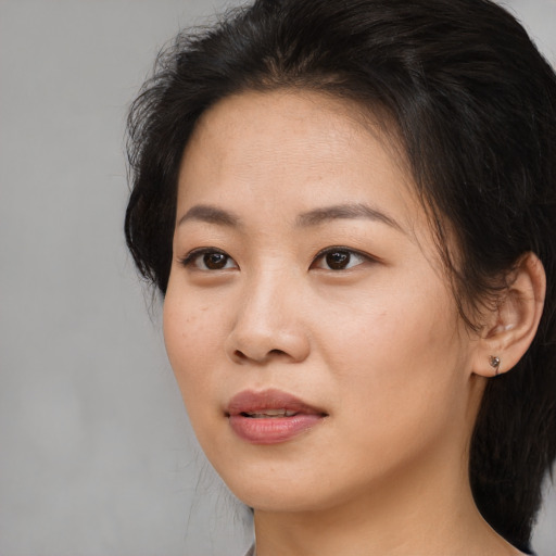 Neutral asian young-adult female with medium  brown hair and brown eyes