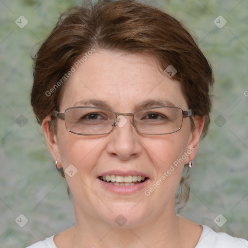 Joyful white adult female with medium  brown hair and blue eyes