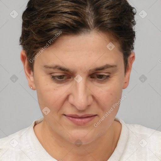 Joyful white adult female with short  brown hair and brown eyes