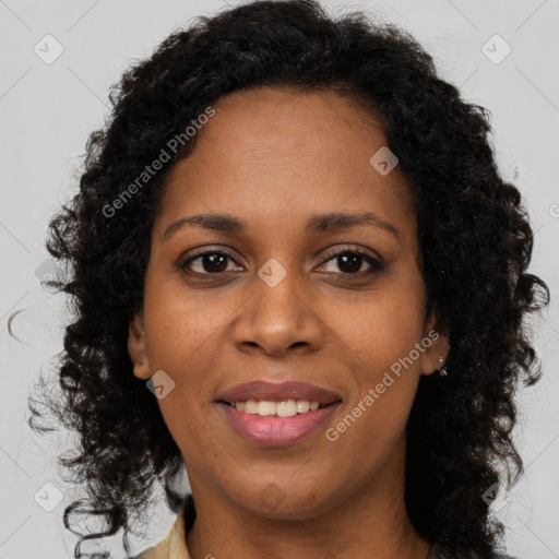 Joyful black young-adult female with long  brown hair and brown eyes