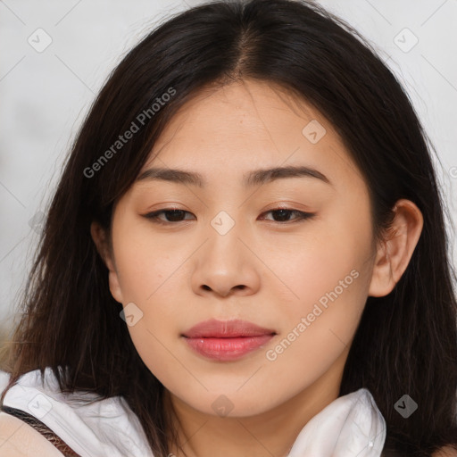 Joyful asian young-adult female with long  brown hair and brown eyes