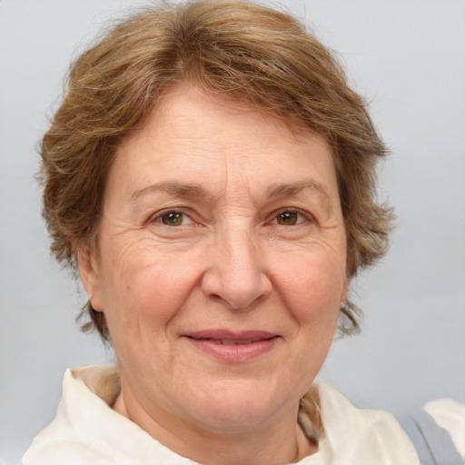 Joyful white middle-aged female with medium  brown hair and brown eyes