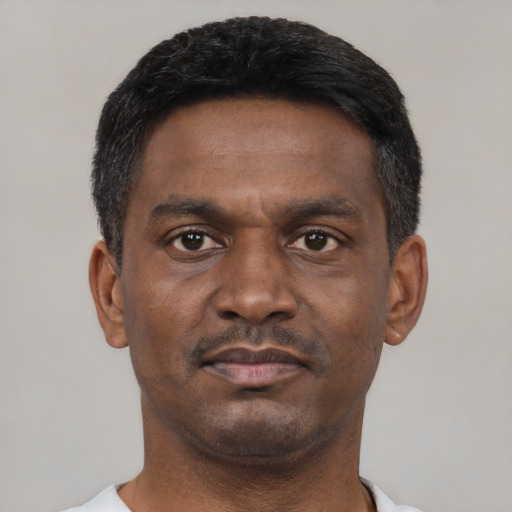 Neutral black young-adult male with short  black hair and brown eyes