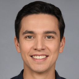 Joyful white young-adult male with short  black hair and brown eyes