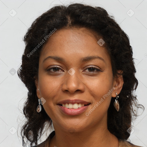 Joyful black young-adult female with long  brown hair and brown eyes