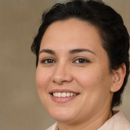 Joyful white adult female with medium  brown hair and brown eyes